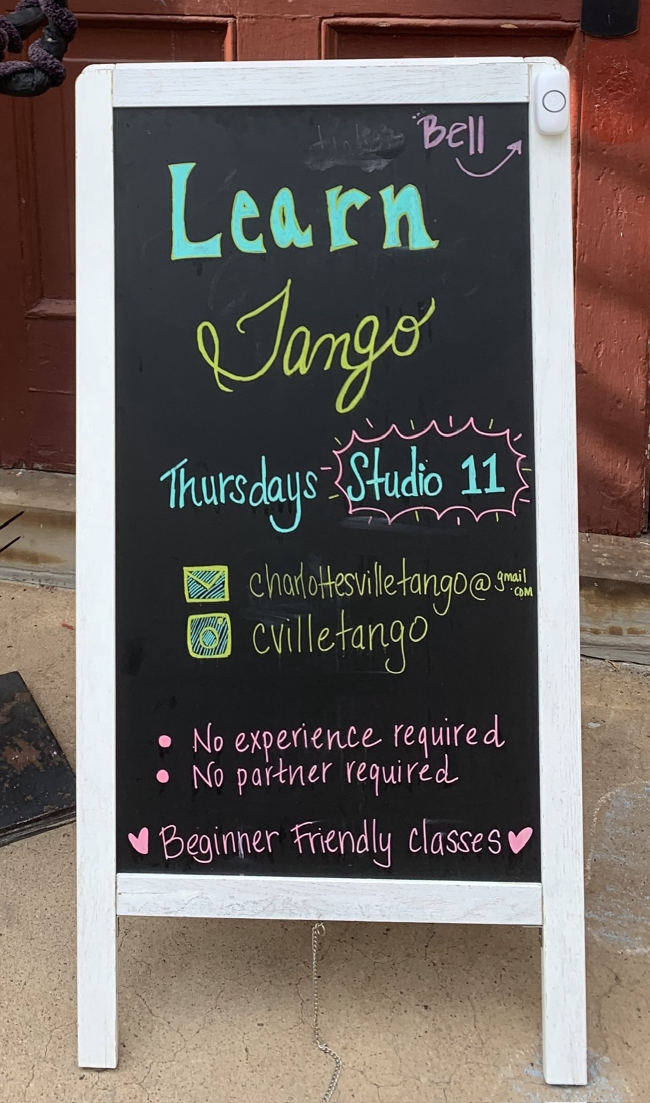 Learn Tango board and doorbell at the south entrance red doors, McGuffey Art Center